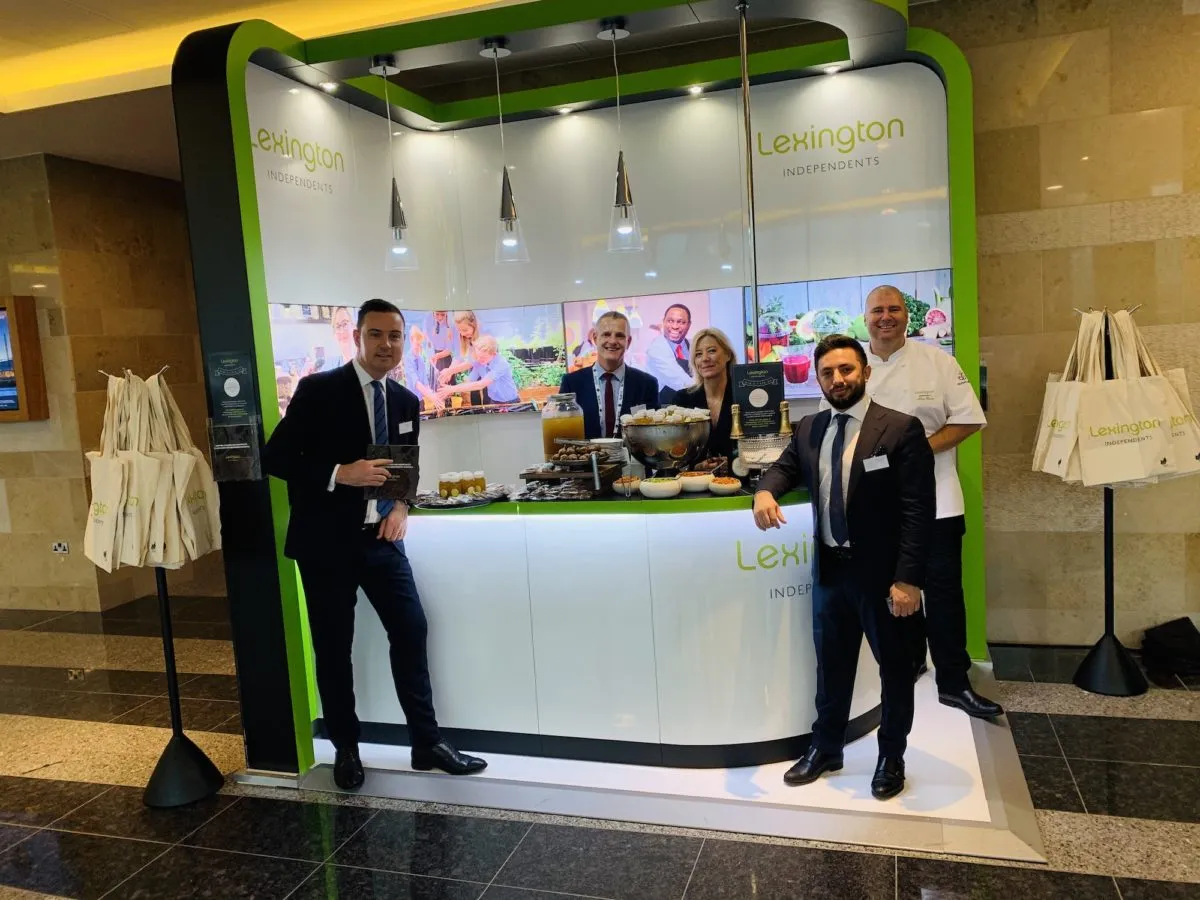 5 people at lexington independents expo