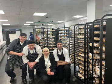 4 chefs in a bakery