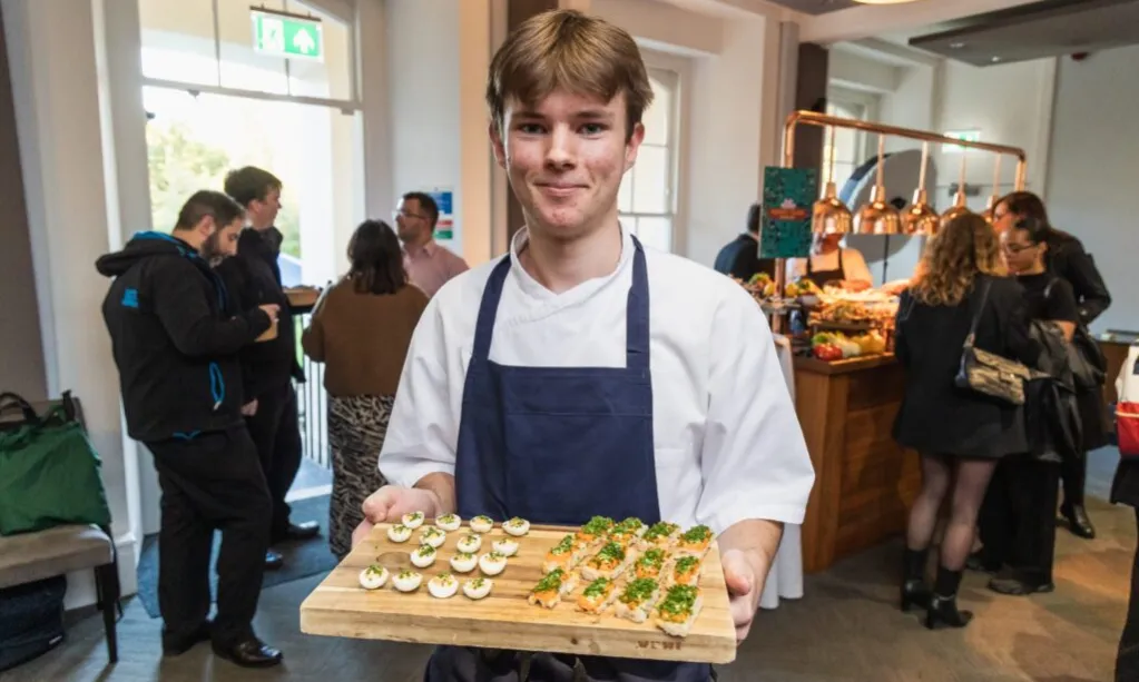 waiter with a tray of food