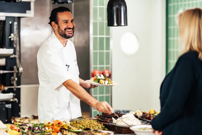 chef smiling to a woman