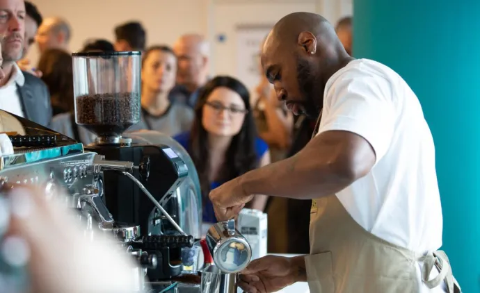 barista making coffee
