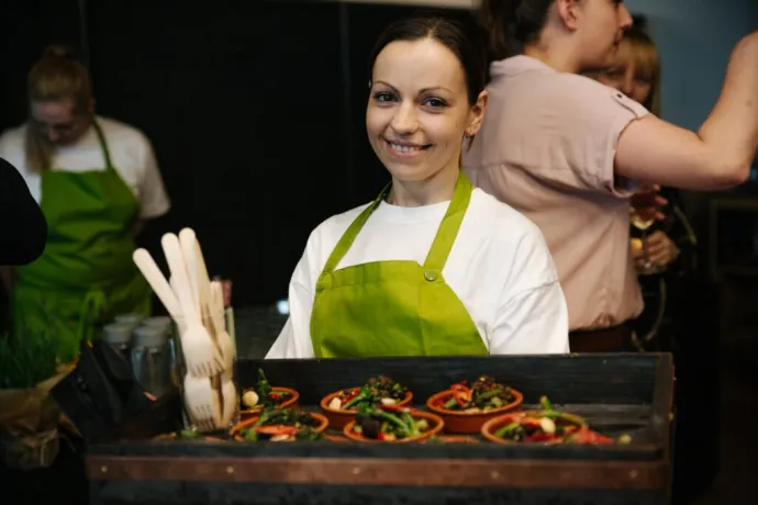 woman holding tray of food