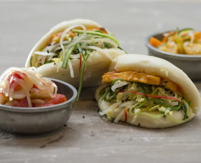 grains greens steamed buns pickled kimchi halloumi with radish